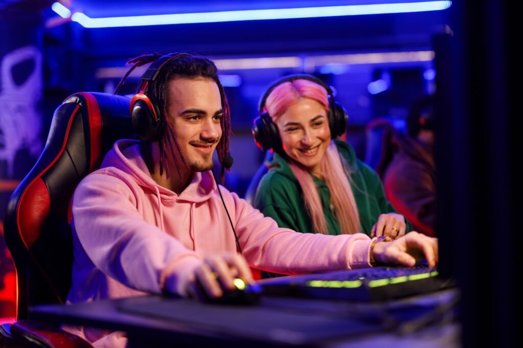 Young man with dreadlocks playing online video game on esport games tournament